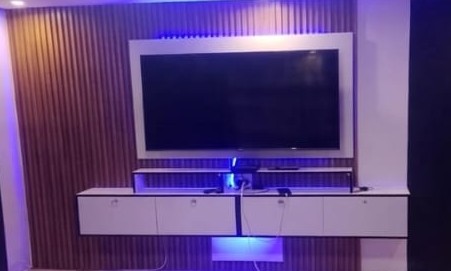 Floating LED TV wall unit with ambient lighting
